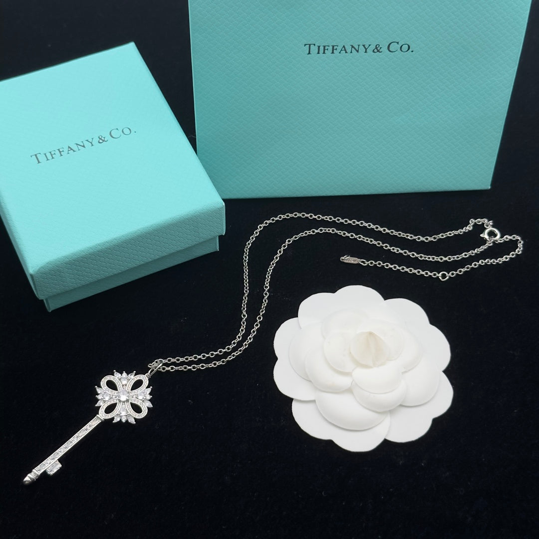 Pavé Crystal Hollow Four-Petal Flower Key Pendant Necklace – Gold, Silver & Rose Gold