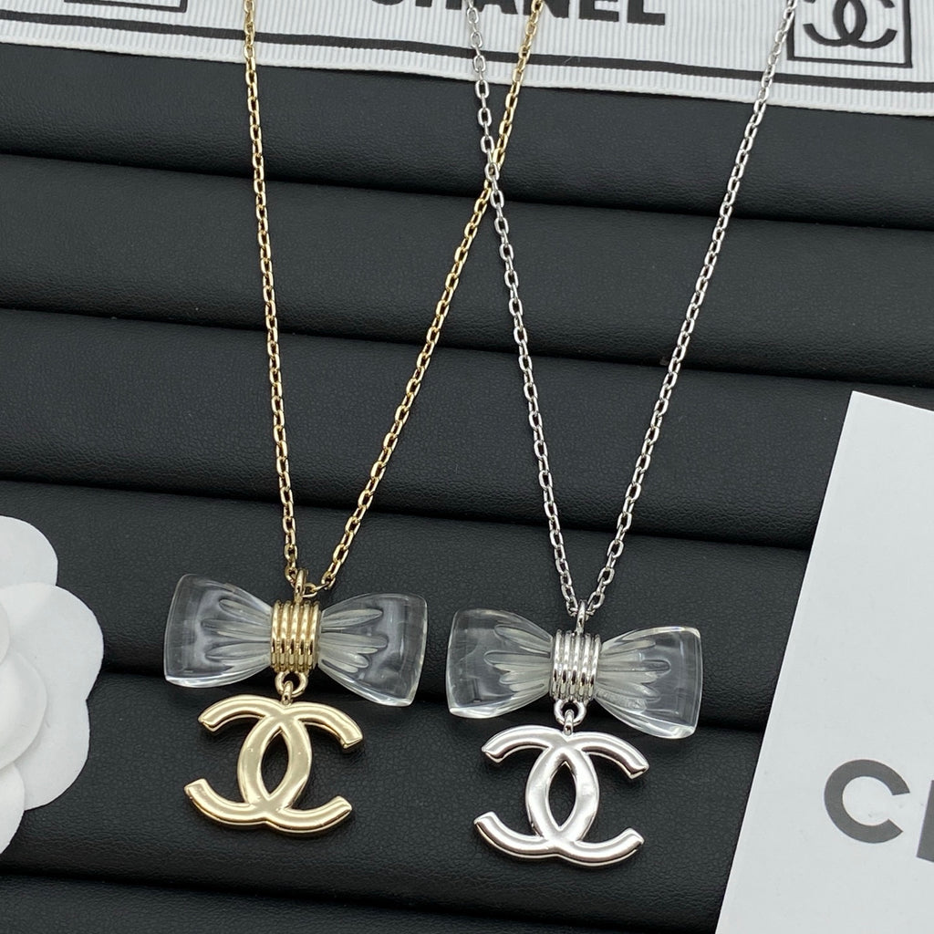 Transparent Bow & Metallic Charm Pendant Necklace – Gold & Silver