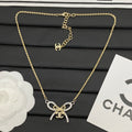 Crystal Pavé Bow Knot Jewelry Set | Logo Charm Clasp | Gold-Tone Necklace & Bracelet