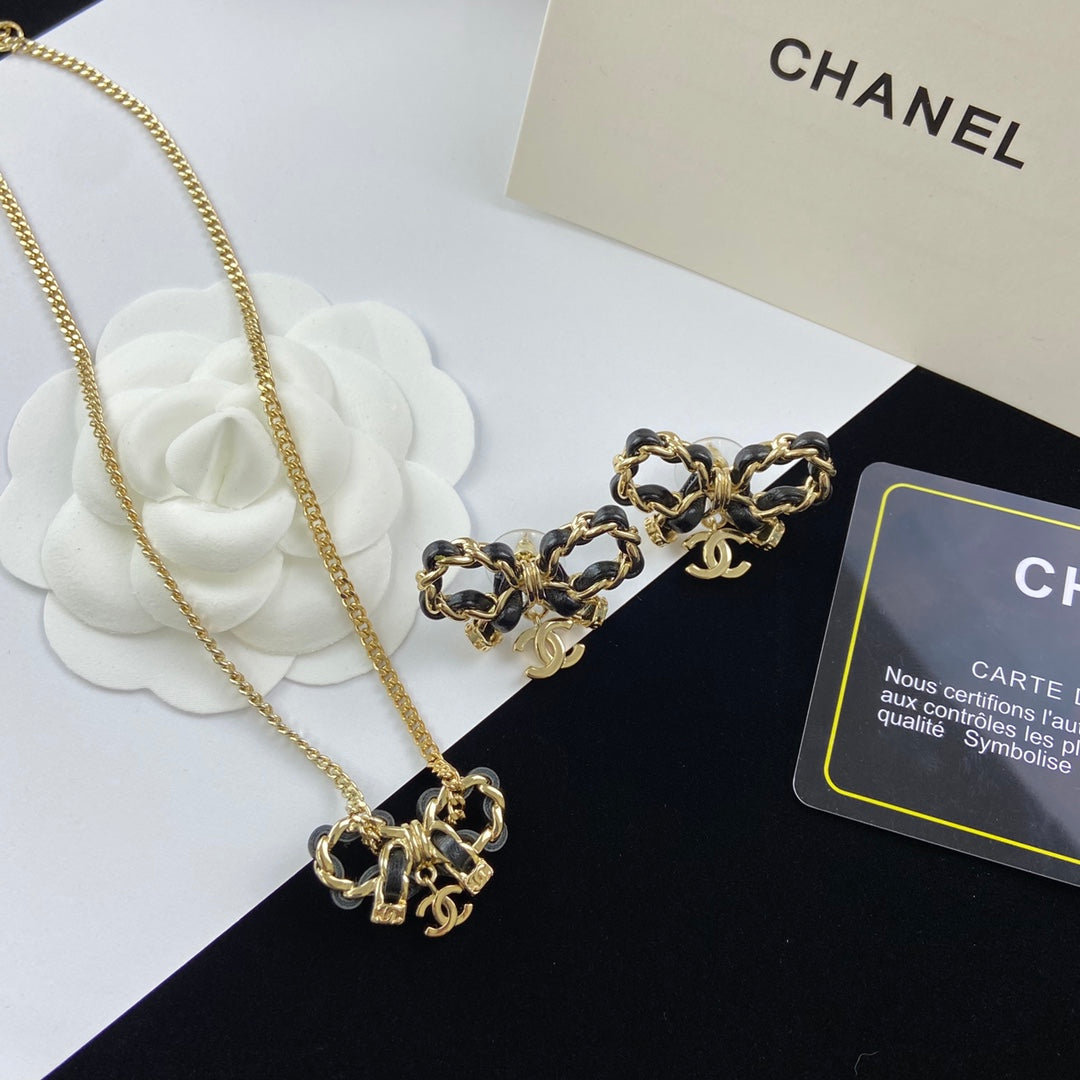 Black Leather-Woven Gold Chain Bow Pendant Necklace & Bracelet Set