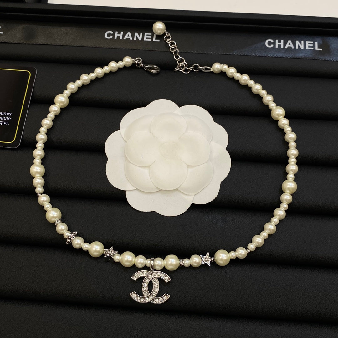 Faux Pearl Beaded Necklace with Crystal Interlocking Loop Pendant & Star Accents