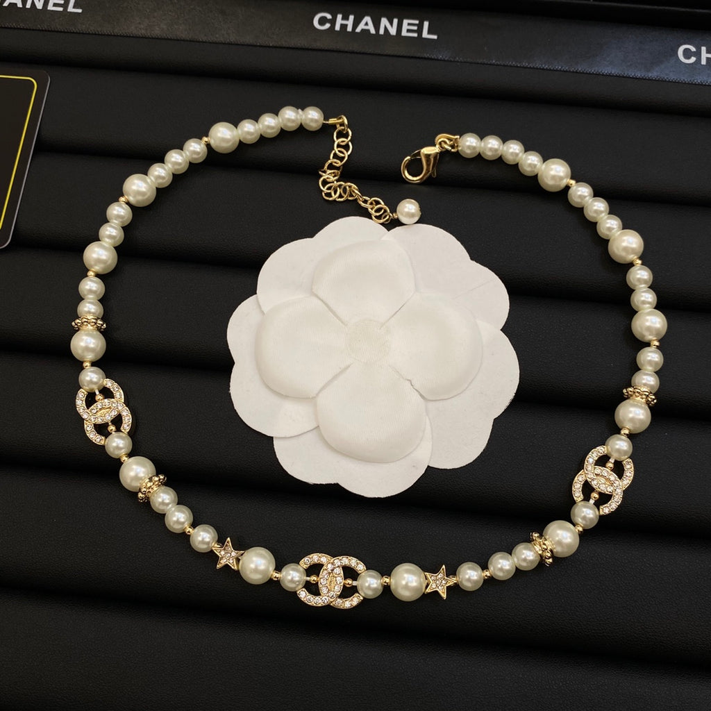 Long Faux Pearl Strand Necklace with Crystal Interlocking Loop & Star Charms