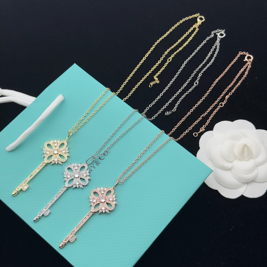 Pavé Crystal Hollow Four-Petal Flower Key Pendant Necklace – Gold, Silver & Rose Gold