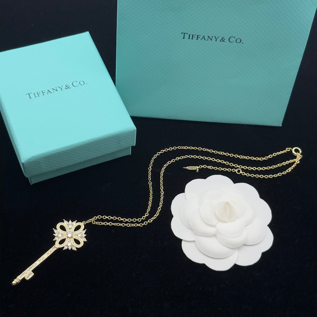 Pavé Crystal Hollow Four-Petal Flower Key Pendant Necklace – Gold, Silver & Rose Gold