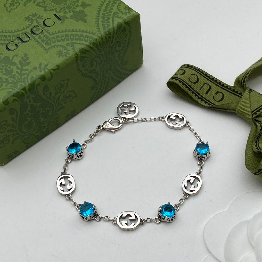 Blue Topaz Crystal Logo Station Chain Jewelry Set
