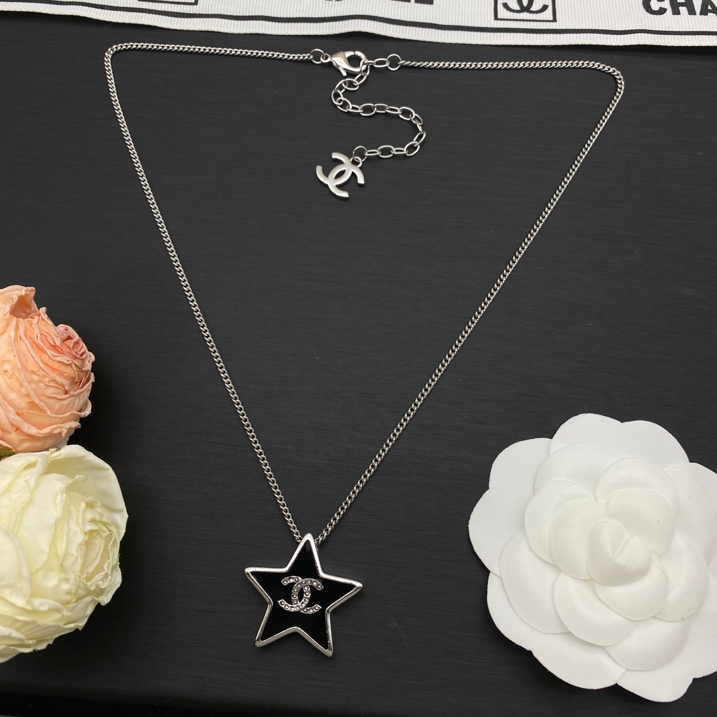 Black Enamel Star Pendant Necklace | Crystal Logo | Gold & Silver Tone
