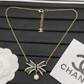 Crystal Bow Pearl Drop Necklace