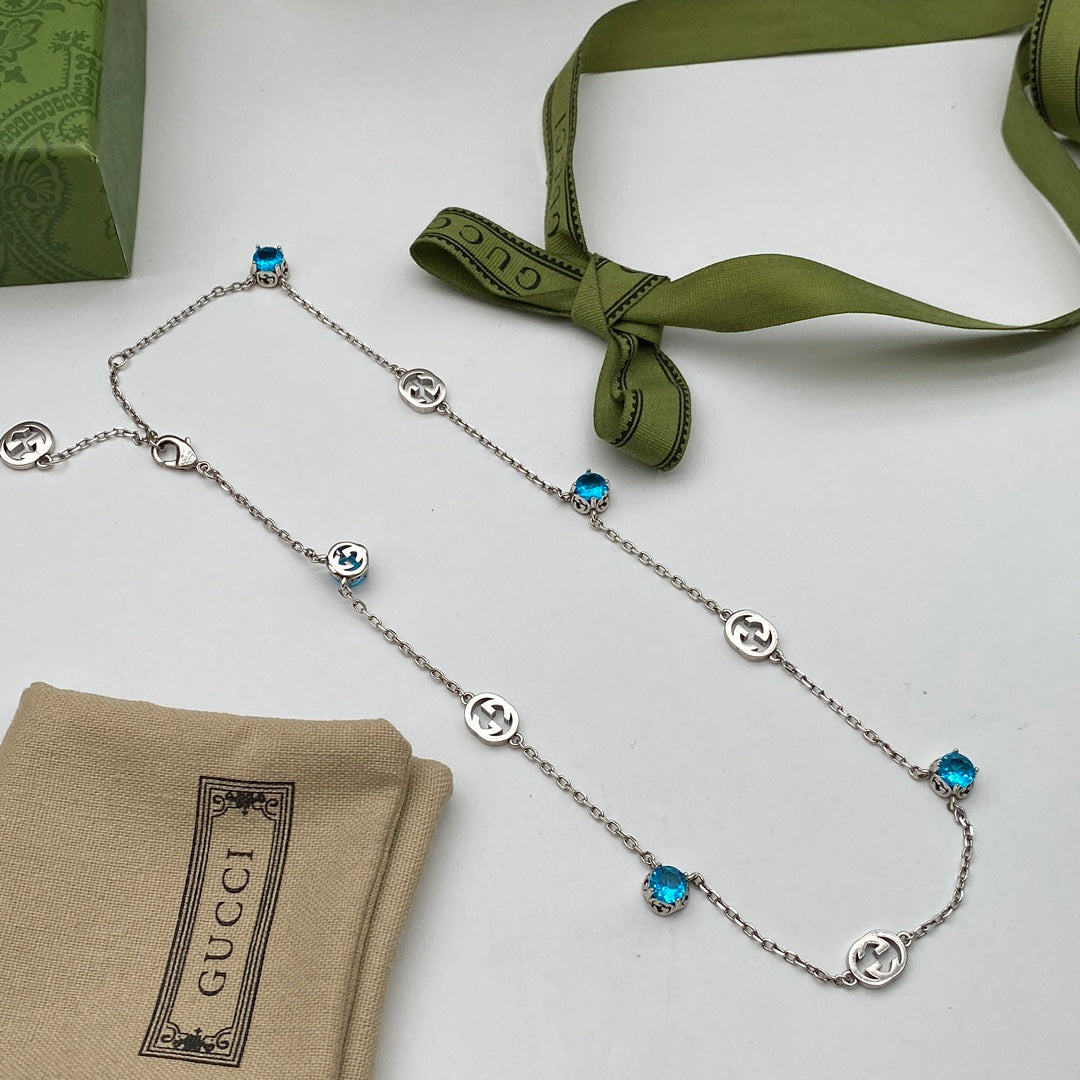 Blue Topaz Crystal Logo Station Chain Jewelry Set
