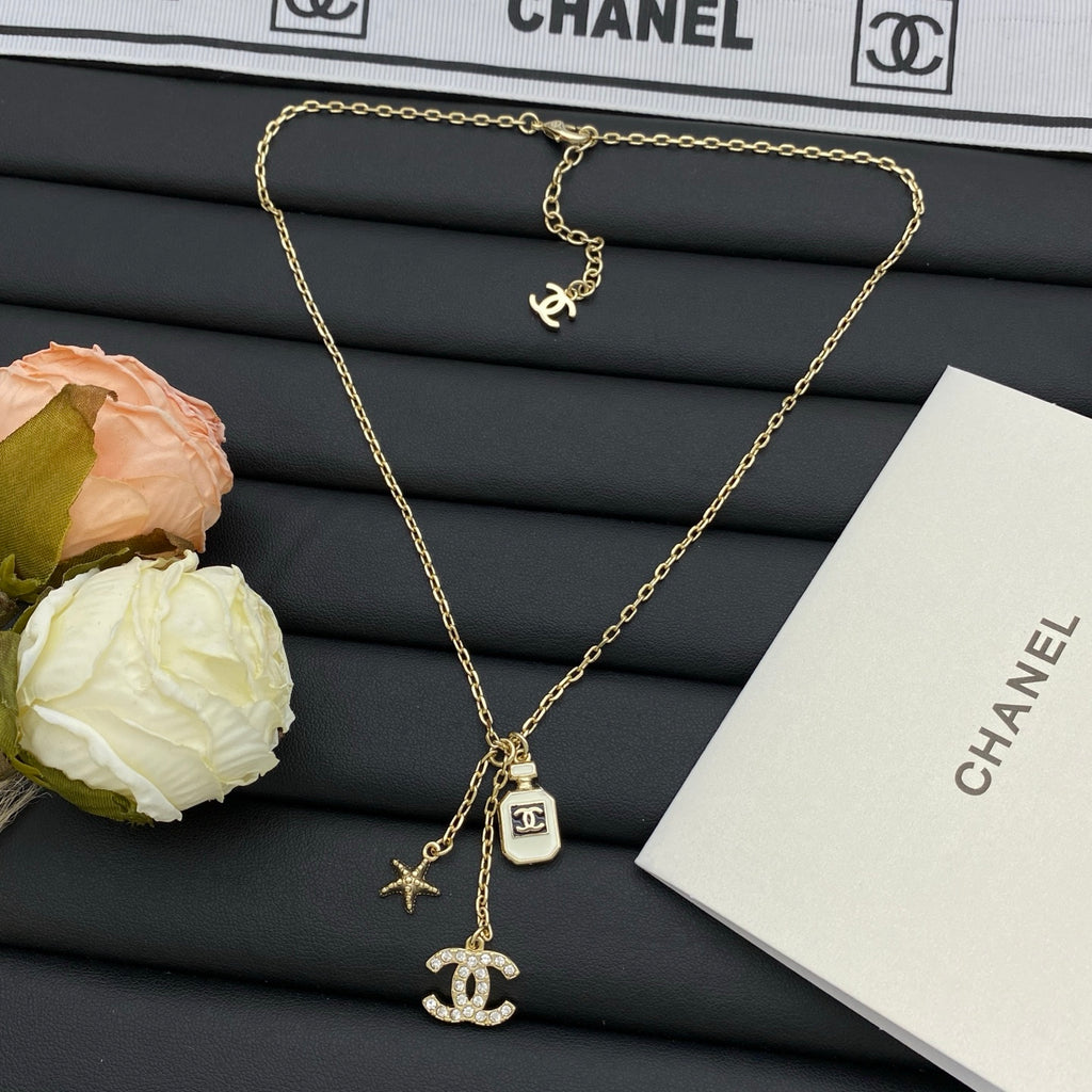 Crystal CC Perfume Bottle & Starfish Charm Necklace