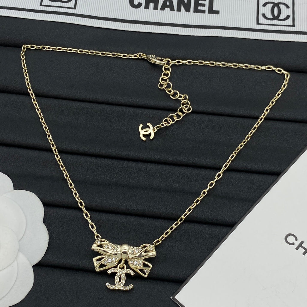 Pavé Crystal Hollow Bow & CC Charm Pendant Necklace – Gold & Silver