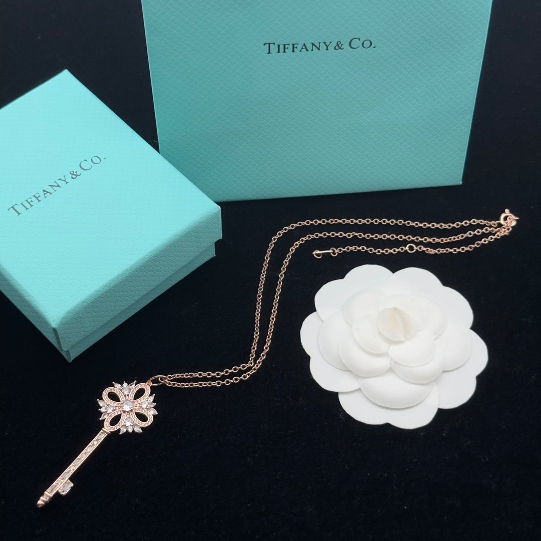 Pavé Crystal Hollow Four-Petal Flower Key Pendant Necklace – Gold, Silver & Rose Gold