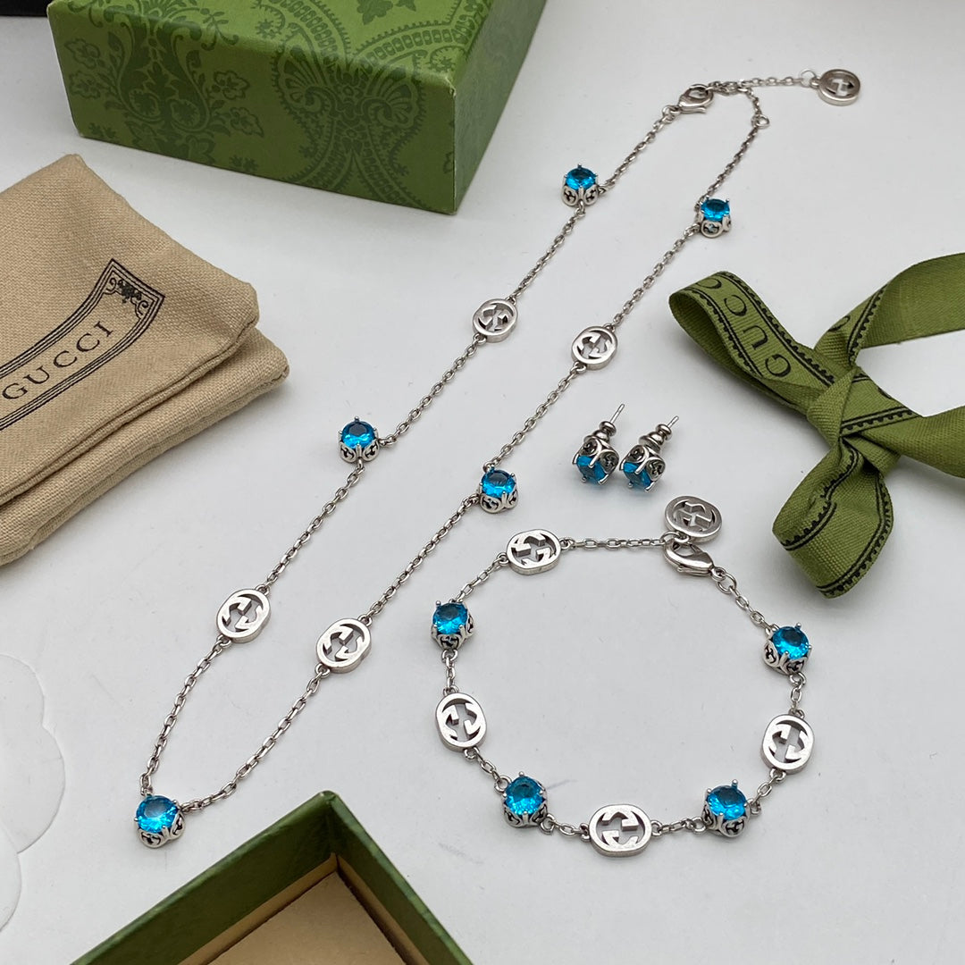 Blue Topaz Crystal Logo Station Chain Jewelry Set