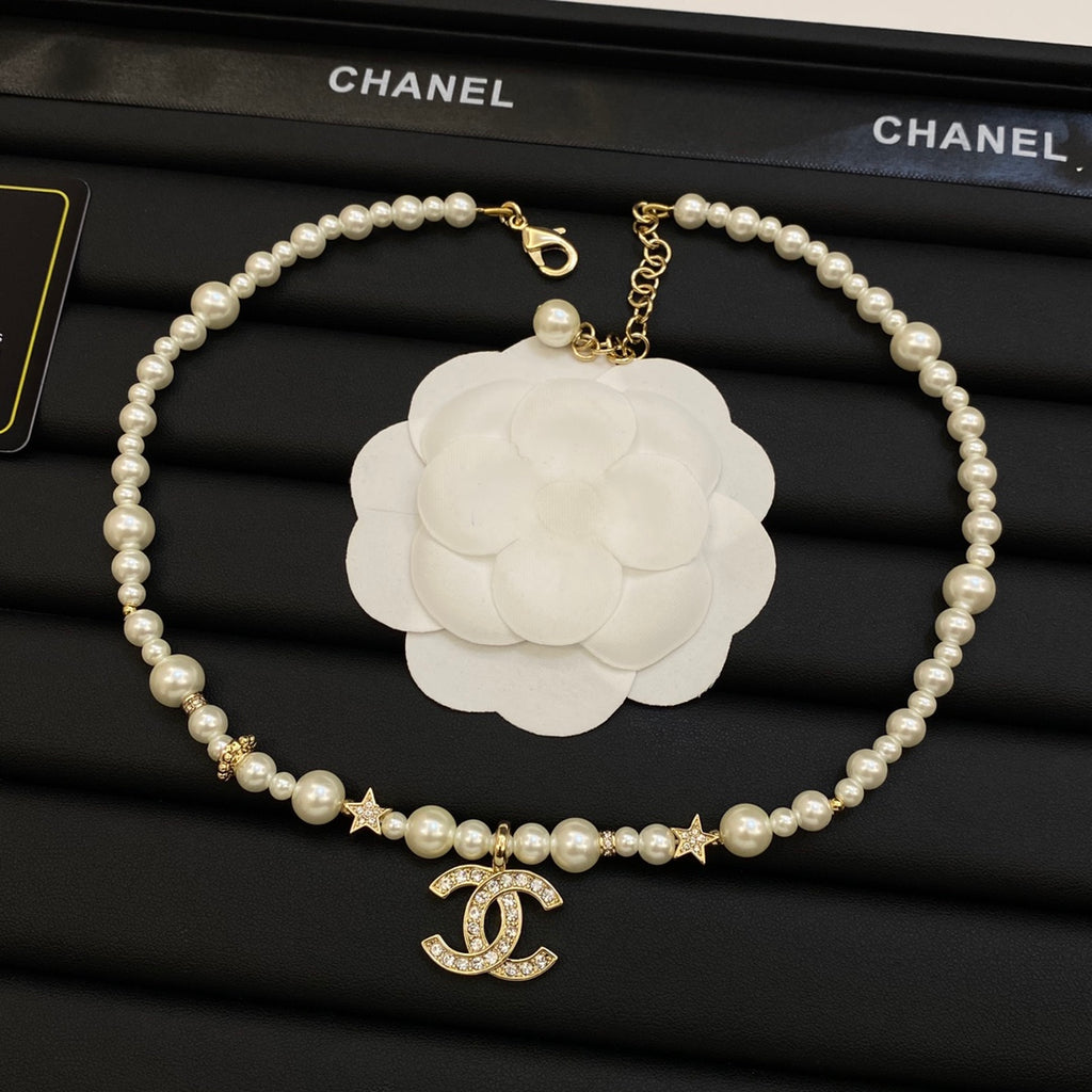Faux Pearl Beaded Necklace with Crystal Interlocking Loop Pendant & Star Accents