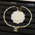 Faux Pearl Beaded Necklace with Crystal Interlocking Loop Pendant & Star Accents