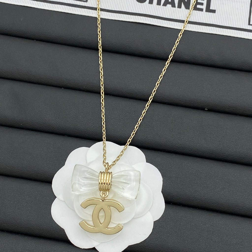 Transparent Bow & Metallic Charm Pendant Necklace – Gold & Silver
