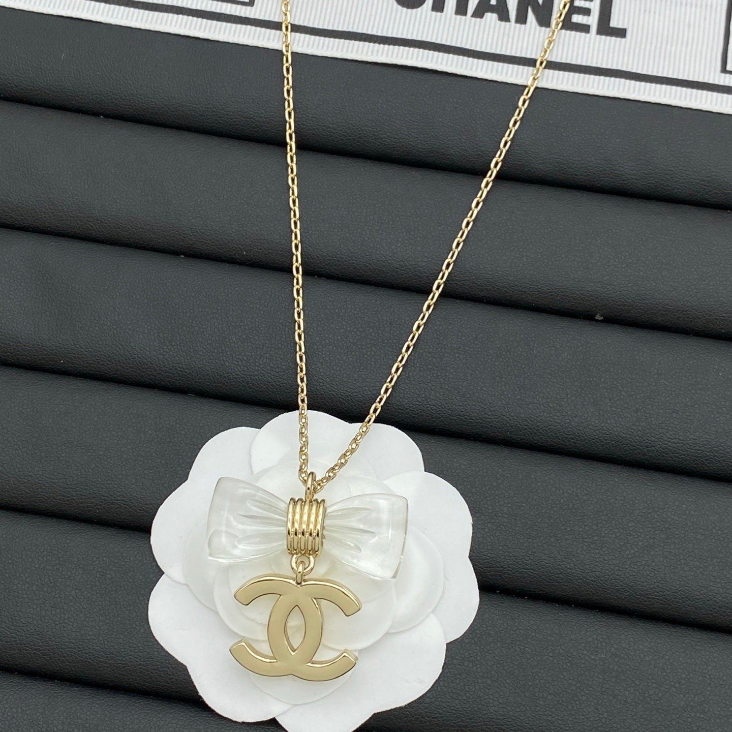 Transparent Bow & Metallic Charm Pendant Necklace – Gold & Silver