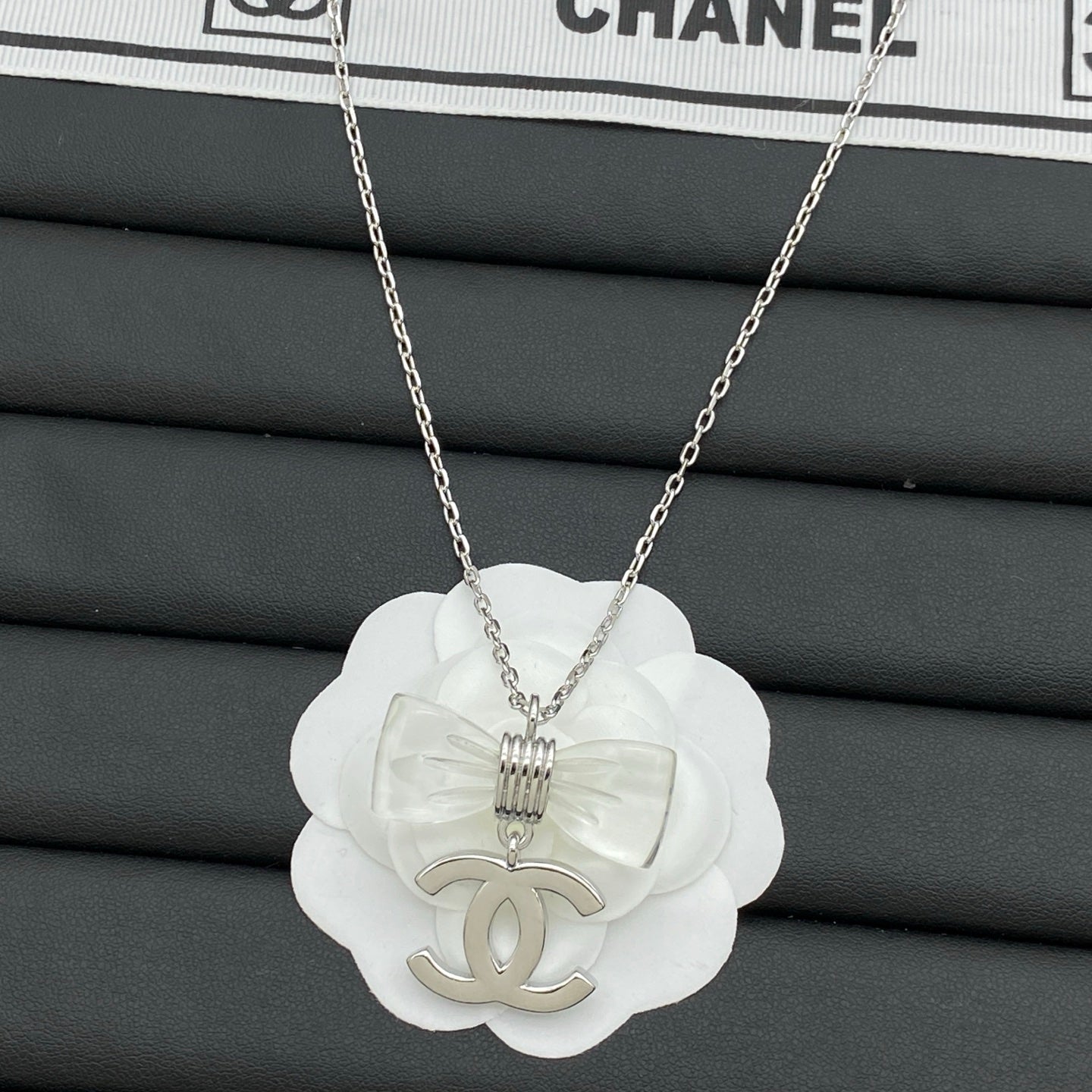 Transparent Bow & Metallic Charm Pendant Necklace – Gold & Silver